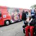 Supporters watch as Republican presidential candidate Herman Cain's campaign bus pulls to the Big Sky Diner in Ypsilanti during a stop on Thursday morning. Melanie Maxwell I AnnArbor.com